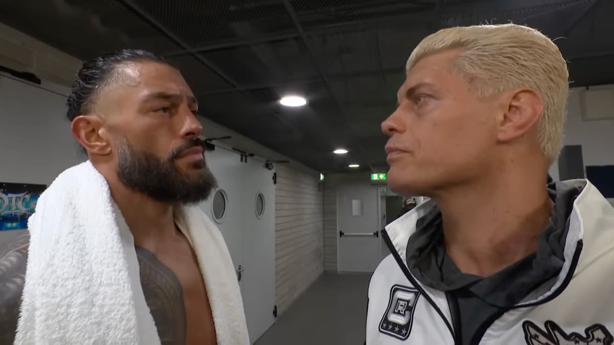 Cody Rhodes and Roman Reigns staring at each other following WWE Clash in Italy