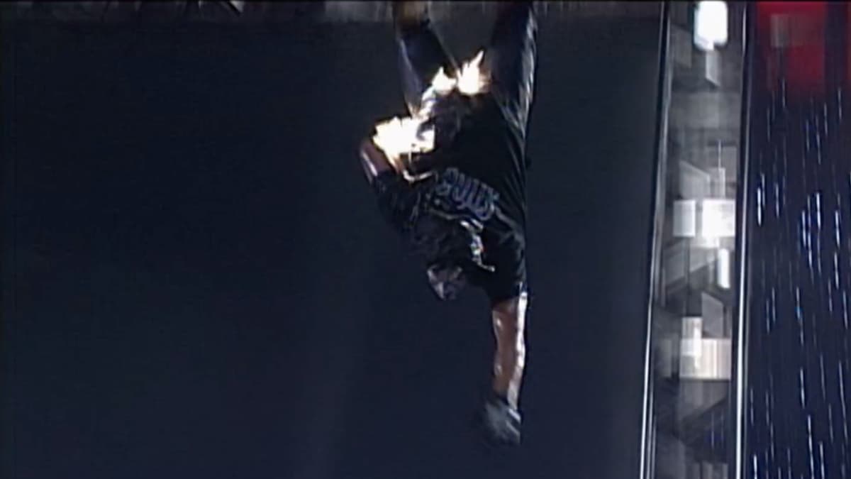 A stuntman dressed as Sting falling through the air while on fire at WCW Great American Bash