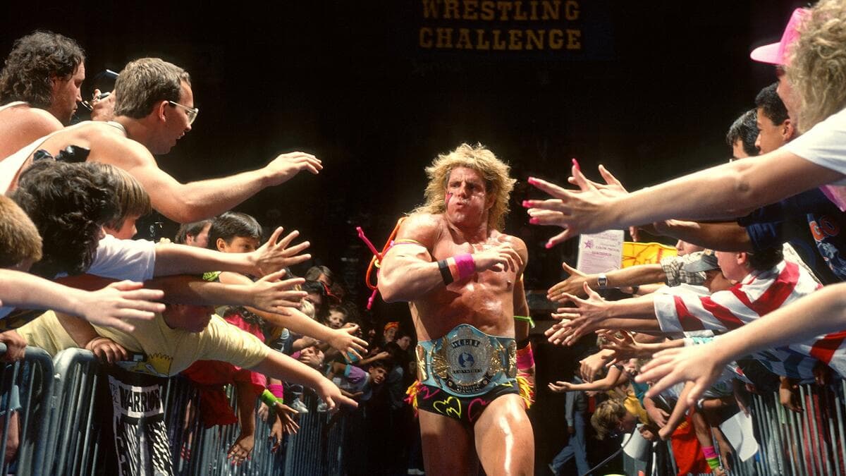 The Ultimate Warrior running to the ring as WWE Champion