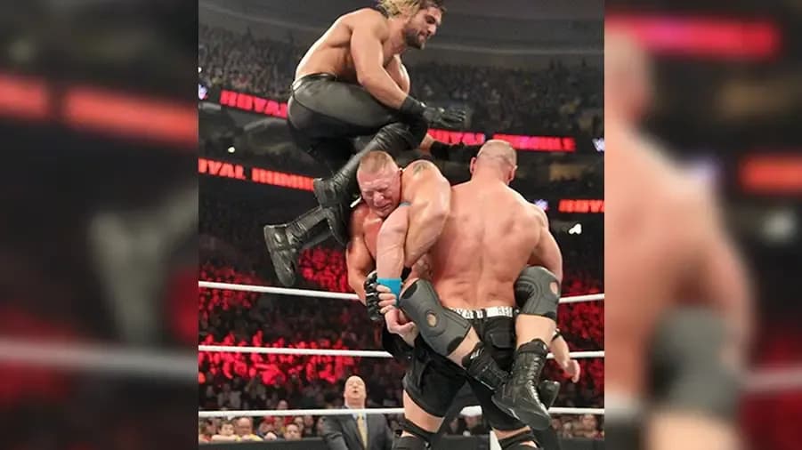 https://cultaholic.com/files/images/2e33c79e54f0664730ce7c1276a6a90e659808e2-lesnar-rollins-cena-royal-rumble-2015.fw_.png