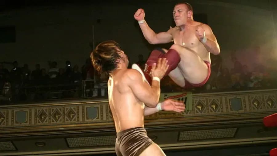 https://cultaholic.com/files/images/6becfc3101eb071277a36afe8337dc82fb4b3a92-KENTA-Daniel-Bryan.jpg