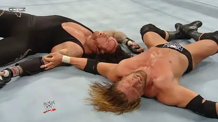 https://cultaholic.com/files/images/c154529b5ecd0163d604c1639a5d71c950460bed-the-undertaker-triple-h-no-way-out-2009.jpg