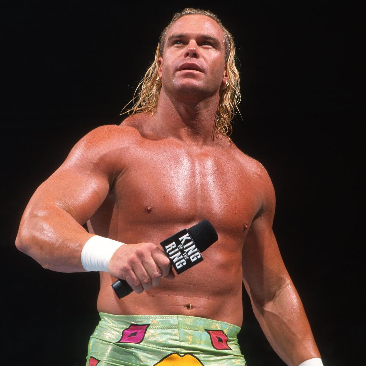 Billy Gunn in green trunks holding a microphone at WWE King of the Ring 1999