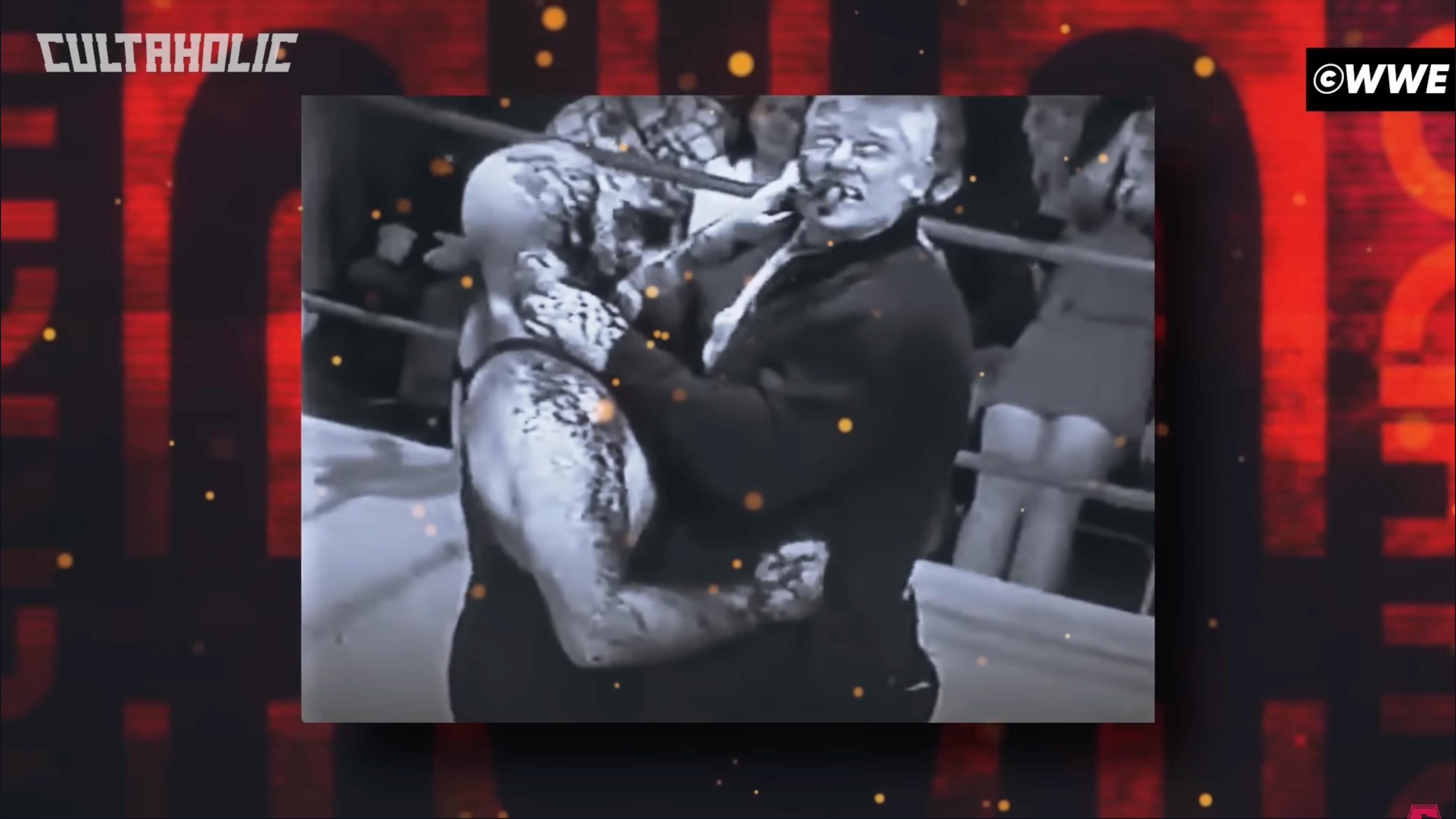 Crusher choking a bloody Mad Dog Vachon