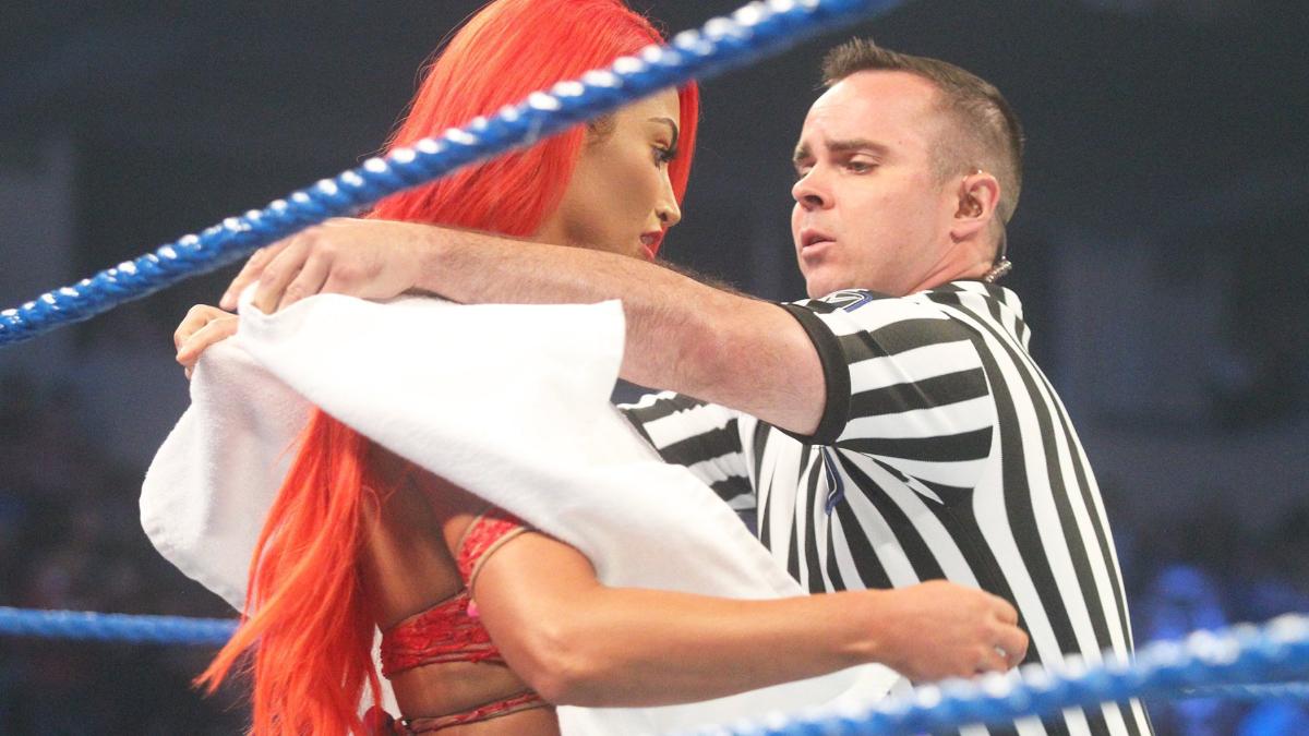 Eva Marie being covered with a towel on WWE SmackDown