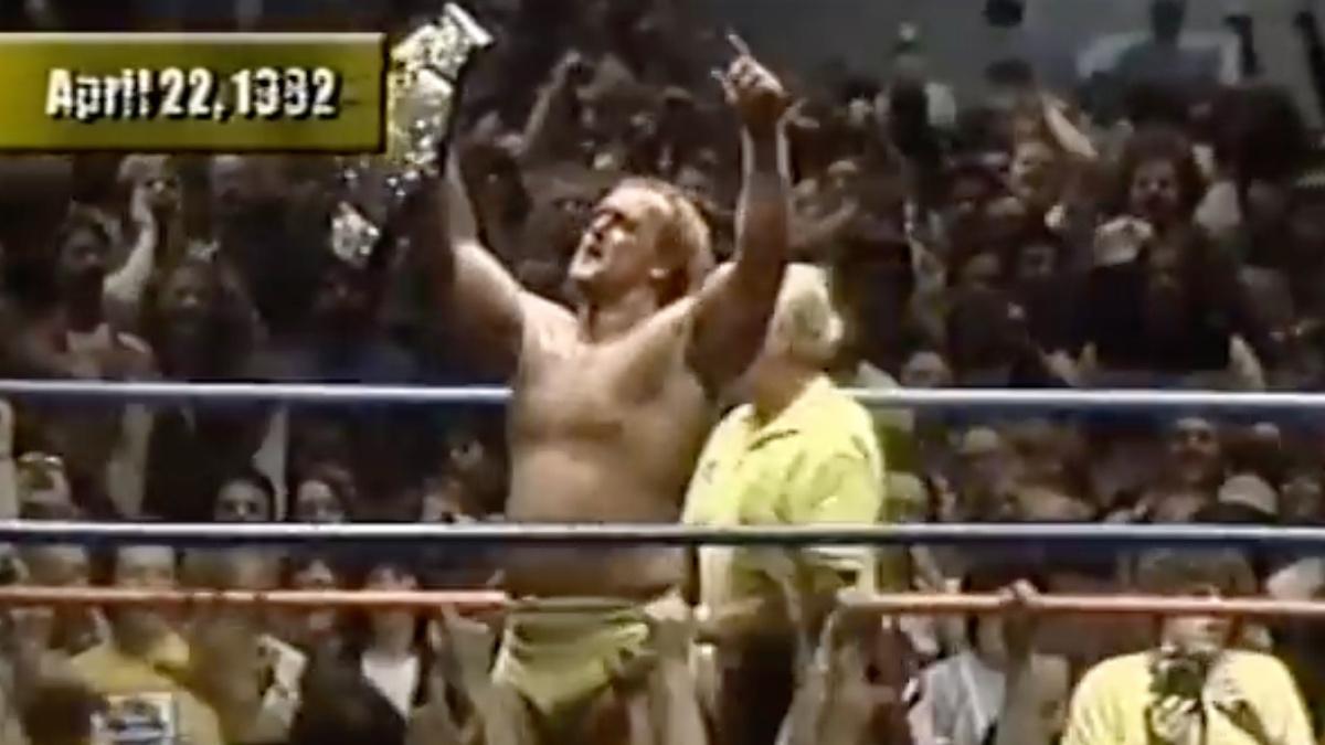 Hulk Hogan celebrating in the middle of the ring holding the AWA World Heavyweight Title