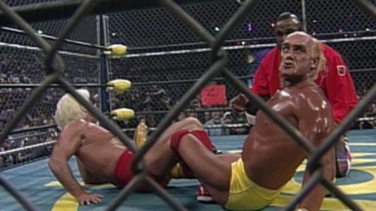 Hulk Hogan with a figure four leg lock on Ric Flair as Mr T referees the Steel Cage Match at WCW Halloween Havoc 1994