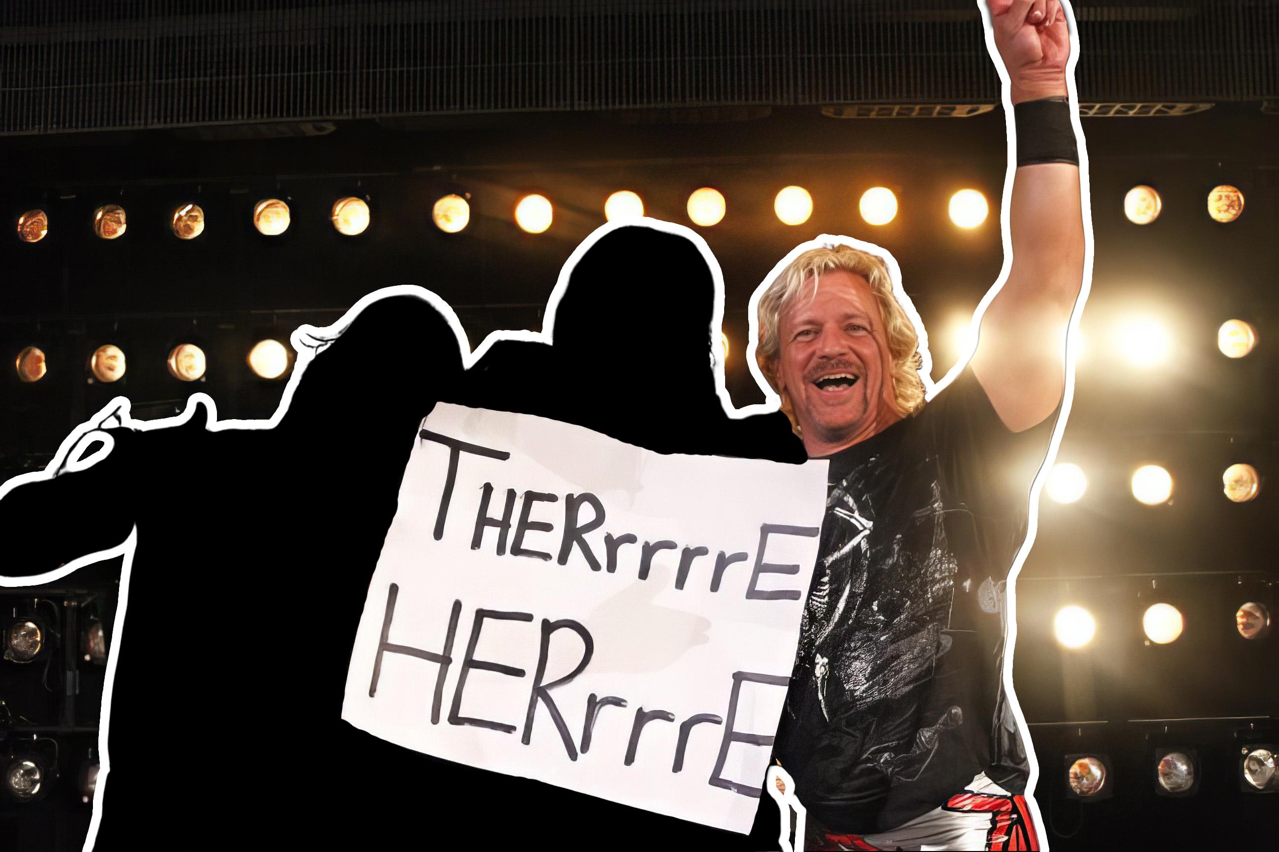 Jeff Jarrett smiling with a "There Here" sign