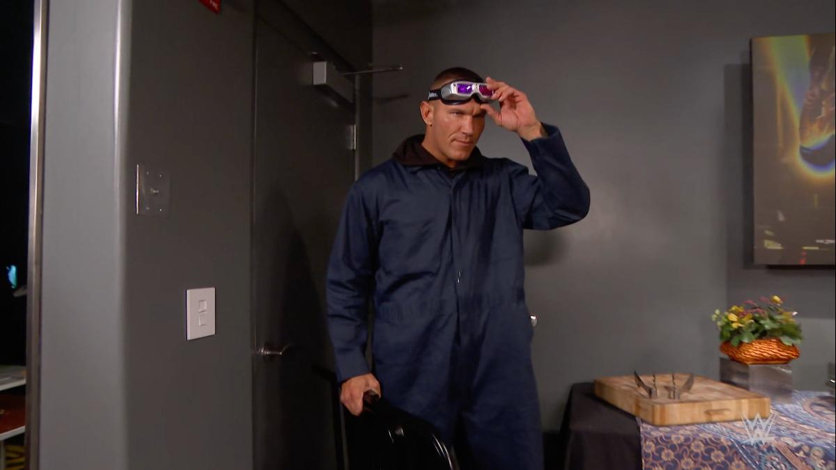 Randy Orton dressed as a janitor putting on night vision goggles on September 28, 2020 episode of WWE Raw