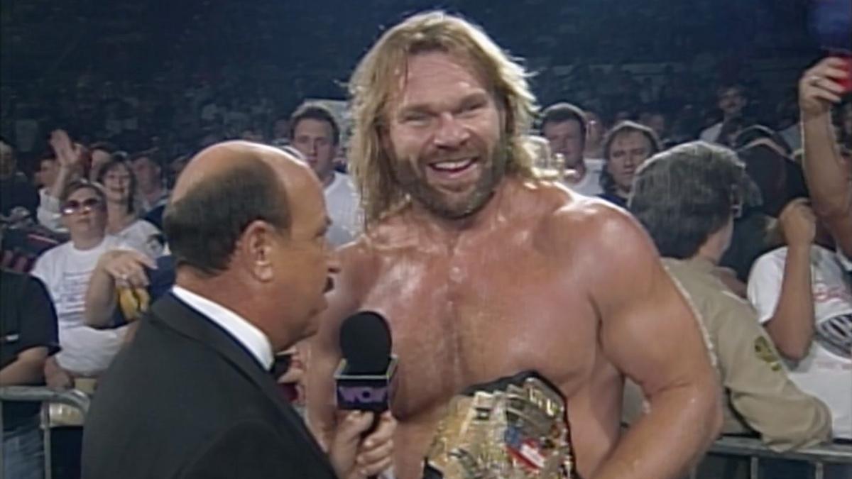 Jim Duggan holding the WCW United States Title being interviewed by Gene Okerlund at WCW Fall Brawl 1994