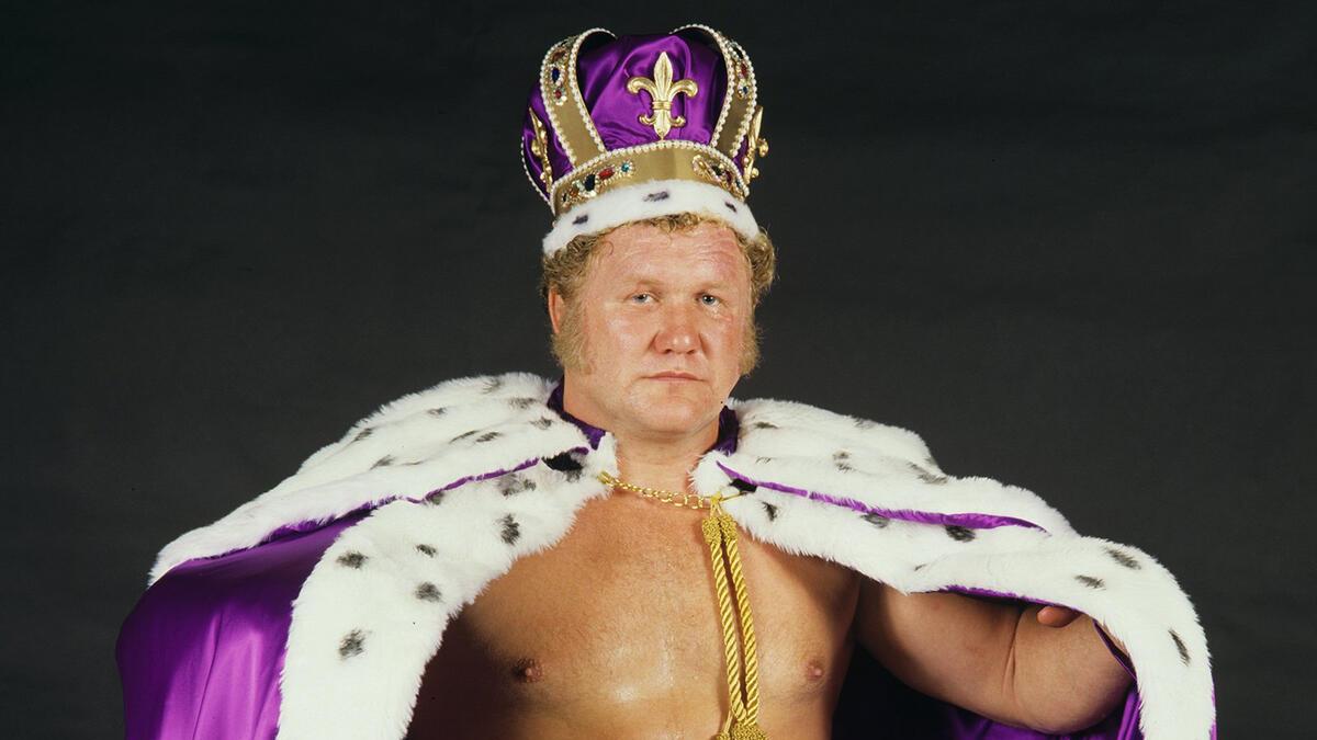 Harley Race wearing a purple crown and cape