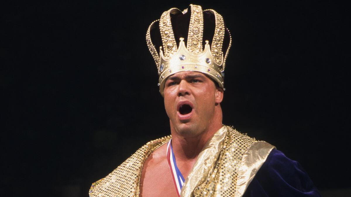 Kurt Angle wearing a big pulp crown gawping with his mouth open