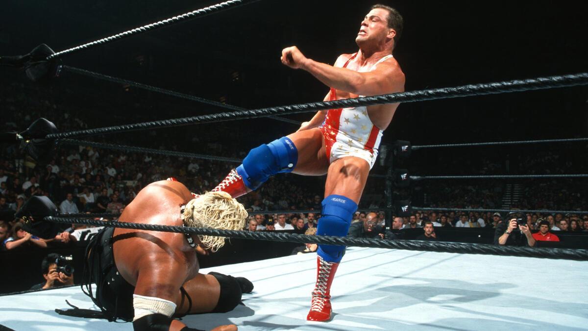 Kurt Angle kicking Rikishi at WWE King of the Ring 2000