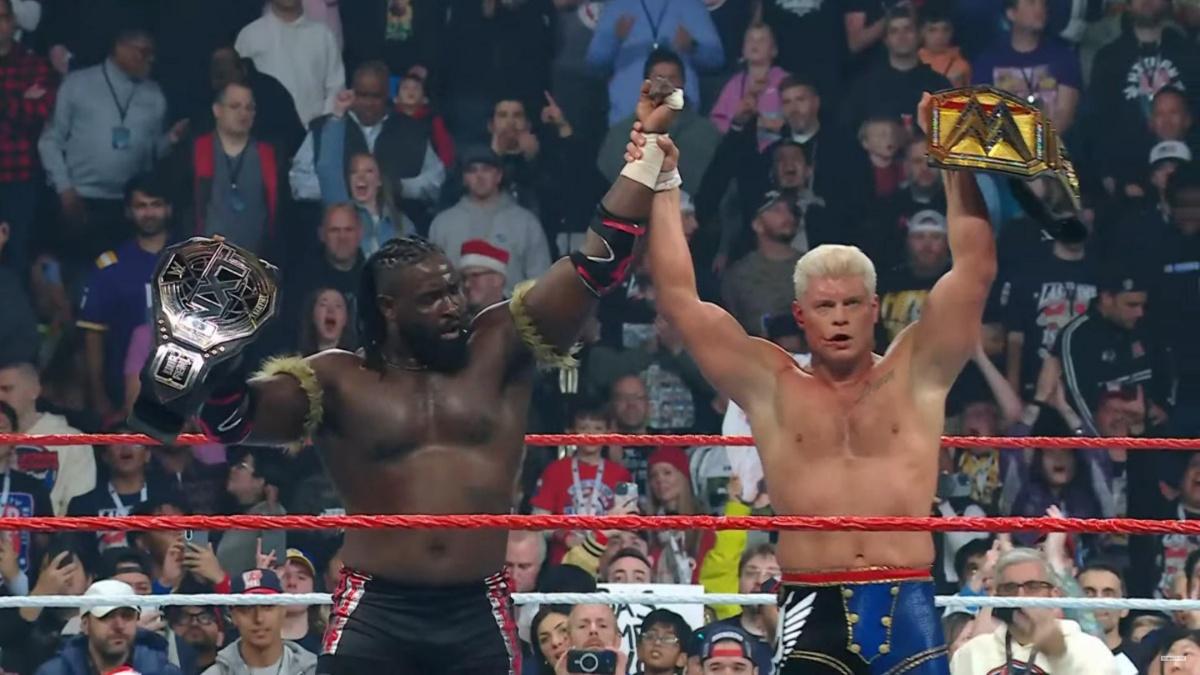 Oba Femi and Cody Rhodes hands raised