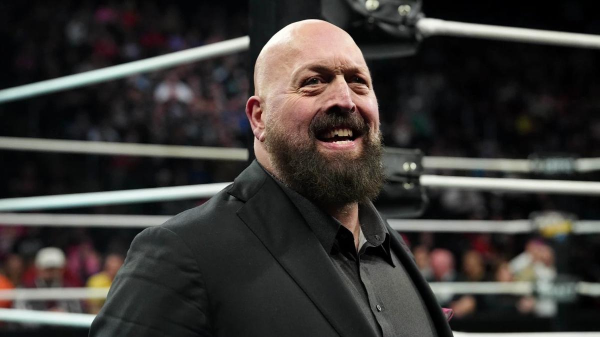 Paul Wight smiling in a black suit at AEW Full Gear 2025