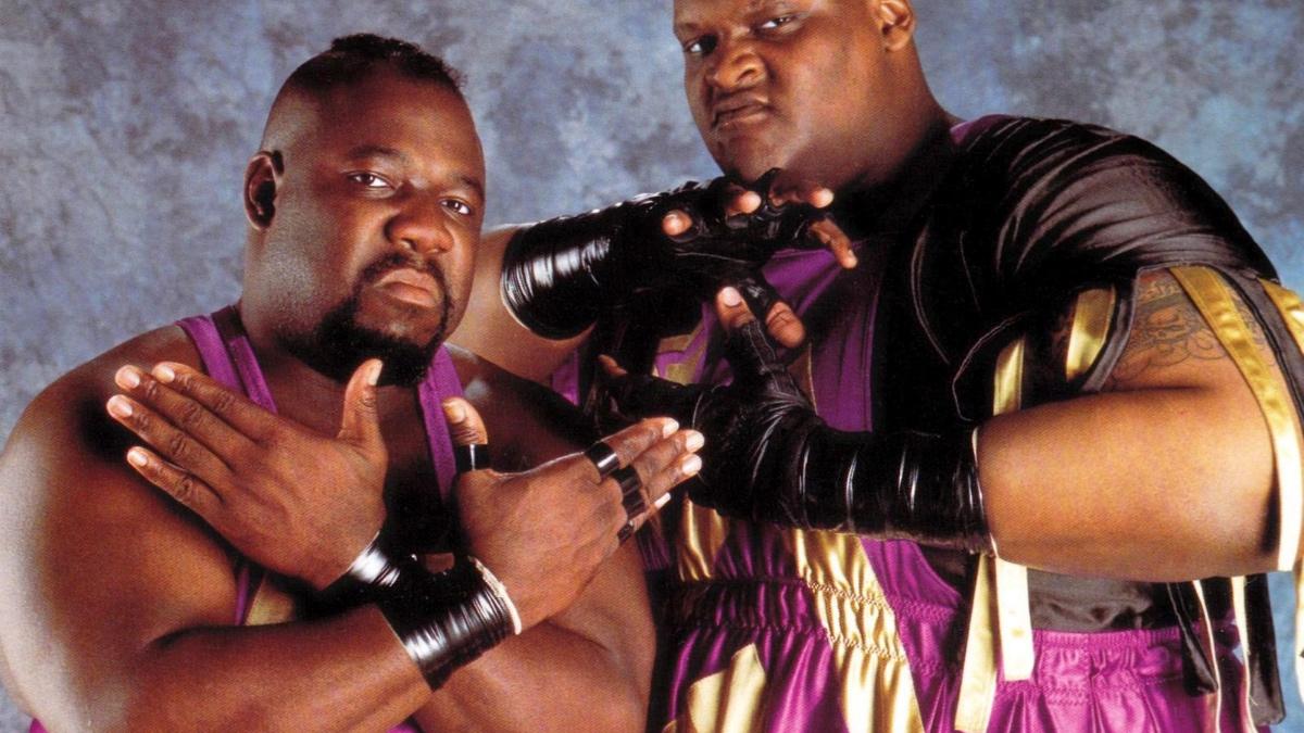 Sir Mo and Mabel of Men on a Mission posing for WWE studio shoot