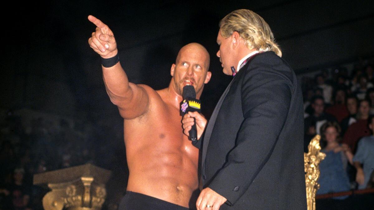Steve Austin pointing at the ring at WWE King of the Ring 1996