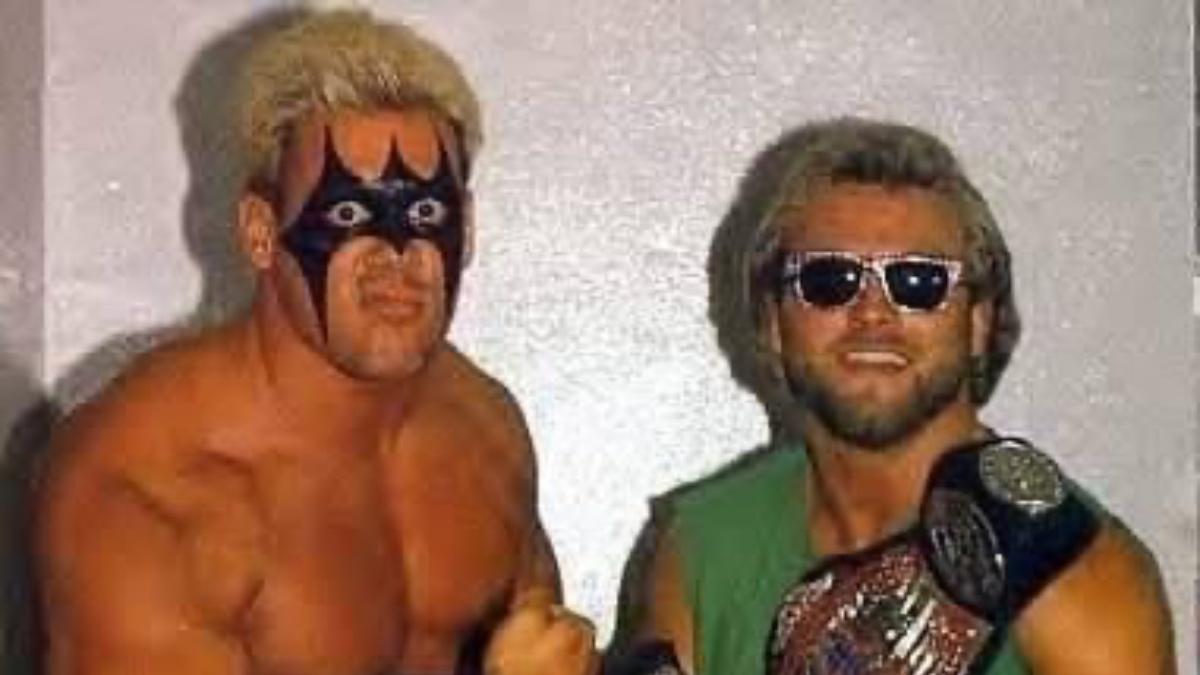 Sting and Eddie Gilbert holding UWF Tag Team Titles