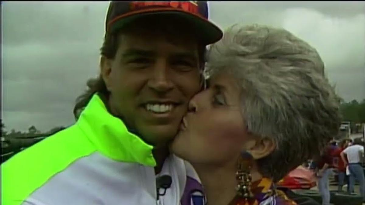 Thurman 'Sparky' Plugg being kissed by older woman