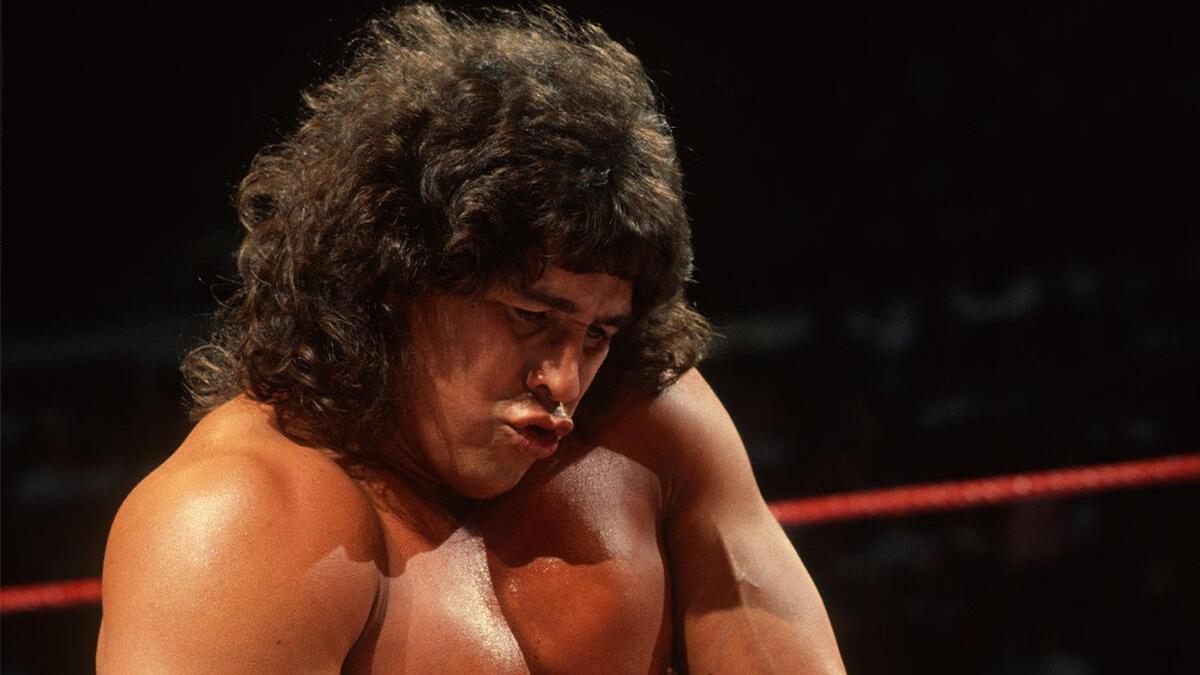 Tito Santana, with a lovely long flowing head of hair, pursing his lips together