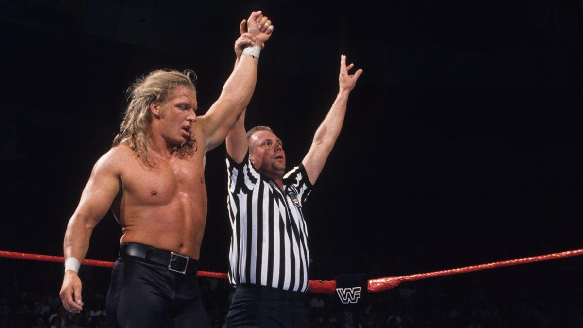 Hunter Hearst Helmsley with his arm raised at WWE King of the Ring 1997