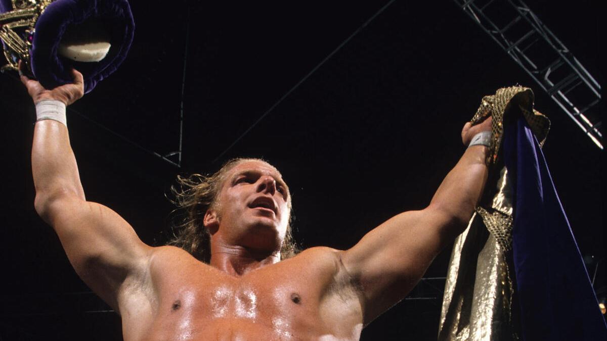 Triple H (Hunter Hearst Helmsley) holding up the King of the Ring crown in 1997