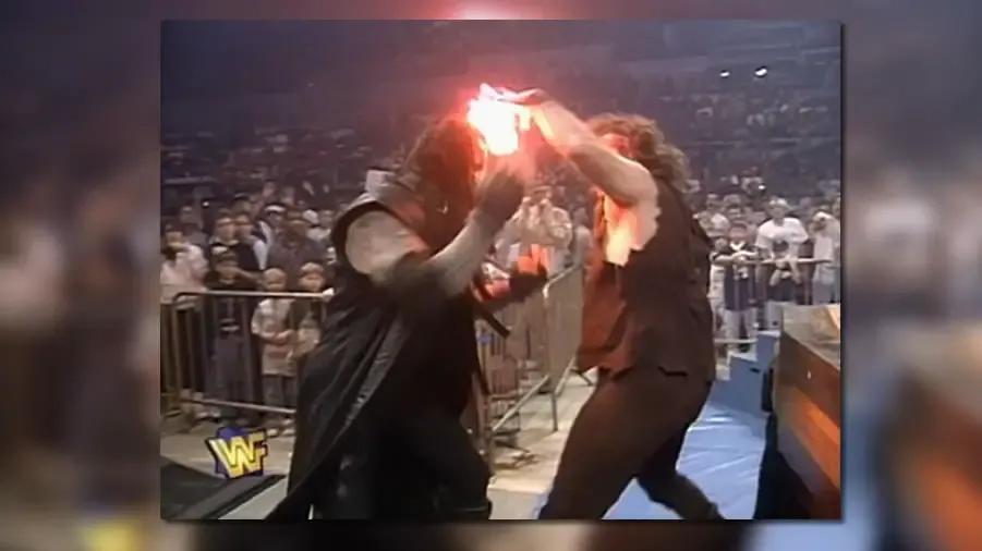 https://cultaholic.com/files/images/3ef09583bdb82a1a18686c8f39cc3f1fed8696d4-the-undertaker-mankind-2.jpg