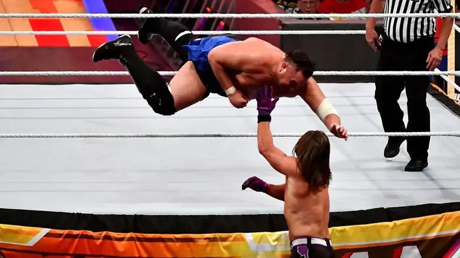 https://cultaholic.com/files/images/b84852bbe37ce25da1f1d8e858538eef52ca8026-AJ-STYLES-SAMOA-JOE-SUMMERSLAM-2018.jpg